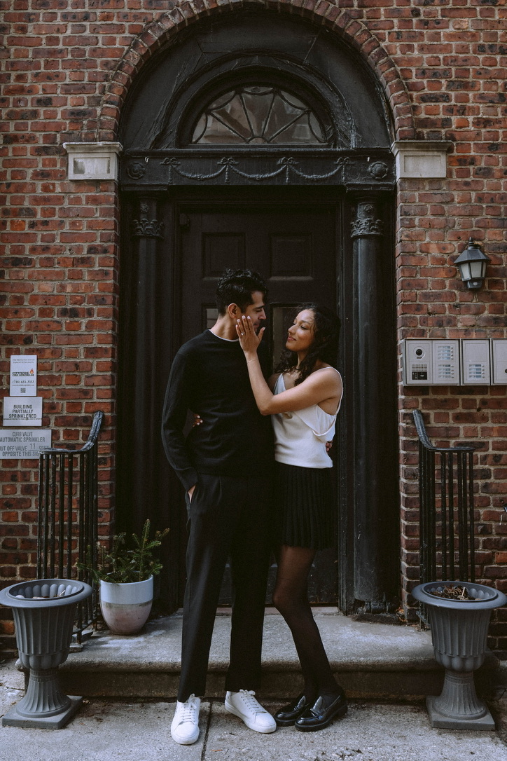 Arjun and Alexandra in a brownstone doorway
